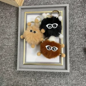 Pendentif adorable en forme de boule de charbon miniature décoratif pour sacs